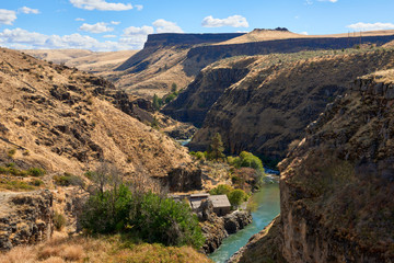 White River canyon view with old power station in Eastern Oregon USA Pacific Northwest.