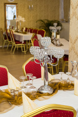 Decorative candlestick on the festively decorated table