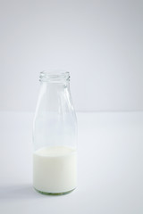 Bottle of milk on white background