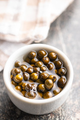 Green peppercorn in brine.