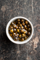 Green peppercorn in brine.