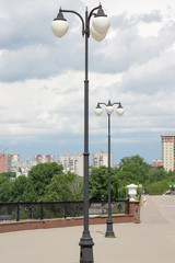 Fototapeta na wymiar Pavement with beautiful lanterns in a big city.
