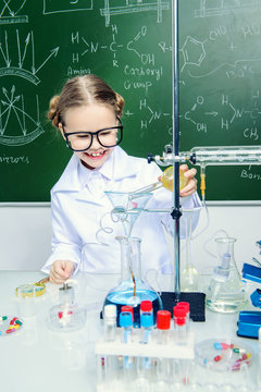 schoolgirl doing experiments