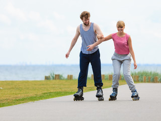 roller skater couple skating outdoor