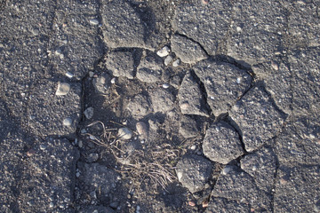 background, asphalt pavement, part of the roadway, pit on the road