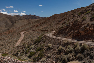 Titus Canyon Road winding through Grapevine Mountains in the Mojave Desert at Death Valley National Park California