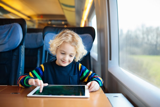 Kids travel by train. Railway trip with child.