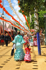 Mother with little daughter at the April Fair, Seville Fair, women from Spain