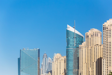 Fototapeta na wymiar construction of a ferris wheel building of the hotel among the skyscrapers of Dubai