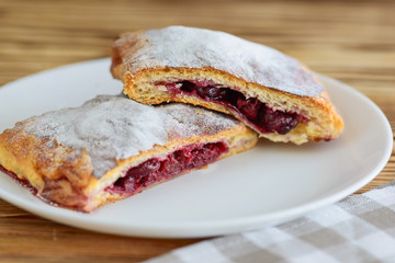 slices of strudel from puff pastry on a wooden table