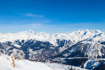 Spectacular snowy mountain panorama in cold winter. Famous ski resort in French Alps - Courchevel 1850, France.