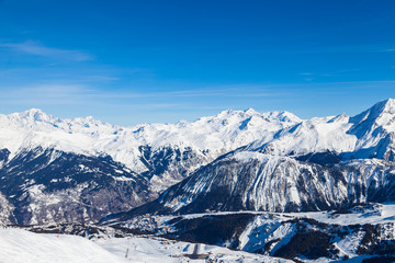 Spectacular snowy mountain panorama in cold winter. Famous ski resort in French Alps - Courchevel 1850, France.