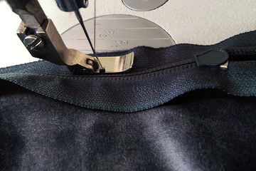 sewing machines, presser foot on the zipper and zipper © vilma3000