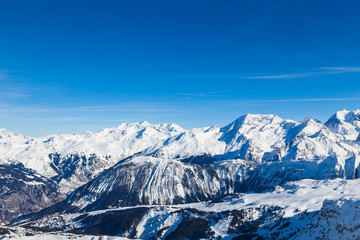 Spectacular snowy mountain panorama in cold winter. Famous ski resort in French Alps - Courchevel 1850, France.