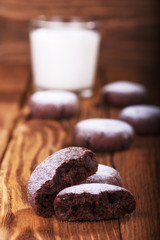Chocolate cookies on a wooden background close up