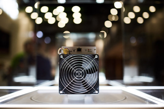 Cryptocurrency mining equipment - ASIC - application specific integrated circuit on farm stand at expo