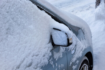 A car is covered by snow, closeup