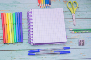 School supplies. Color pencils,note book, blue pens, sciccors, markers, glue, pencil sharpener,...
