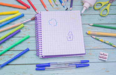 School supplies. Color pencils,note book, blue pens, sciccors, markers, glue, pencil sharpener,...