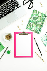 Artistic home office desk workspace with clipboard, laptop, notebook and stationery on white table background. Flat lay, top view blog concept.