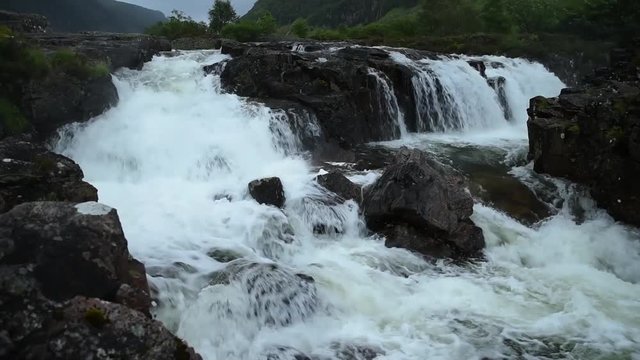small waterfall on the river coe in the scottish highlands