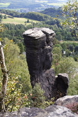Rock standing on hill top.