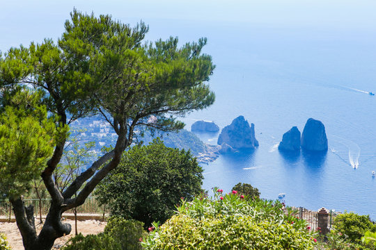 Italy. Island Capri. Faraglioni rocks and boats from Monte Solaro, in Anacapri