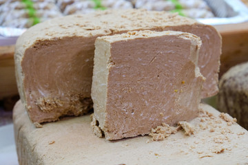Oriental halva of sweets made by hands closeup photo