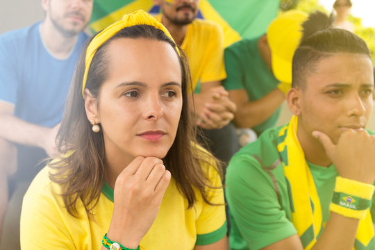 Friends from Brazil watching football match.