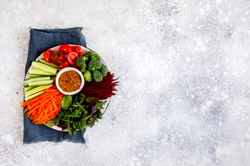 Salad Vegetables on a Plate and Stone Background with mustard sauce Vegetarian Food or Healthy diet...