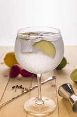 Glass of gin tonic cucumber,lime and ice