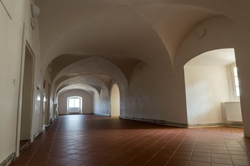 a view of the historic hallway with vaulted ceiling