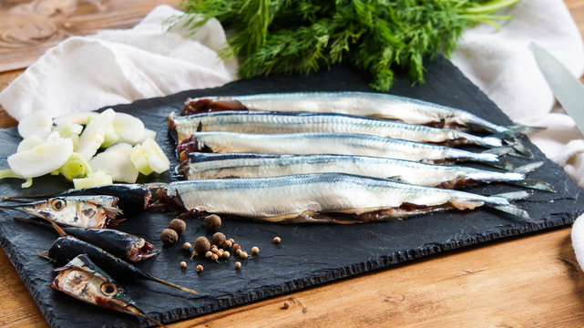 raw fresh needlefish (belonidae family) on the plate ready to cook