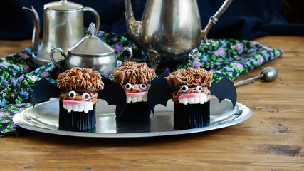 chocolate muffins in the form of vampire bats. for Halloween party