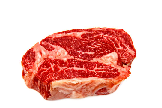 Raw Marbled Beef, Chuck Roll Steak On White Background.