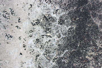 Fototapeta na wymiar Grunge concrete wall macro texture. Cement grungy grey textured with dark spot. Retro background