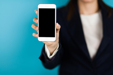 Female hand holding a phone