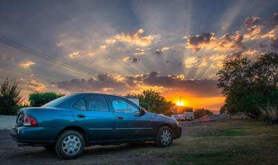 Fototapeta na wymiar Car in the sunset