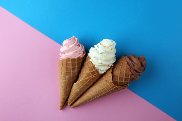 Vanilla frozen yogurt or soft ice cream in waffle cone.