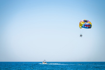 Parasailing on sea. Parasailing is a popular pastime in many resorts around the world.