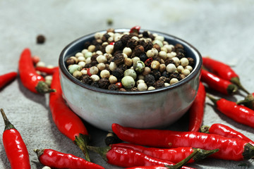 red hot bird chili pepper with pepper corns