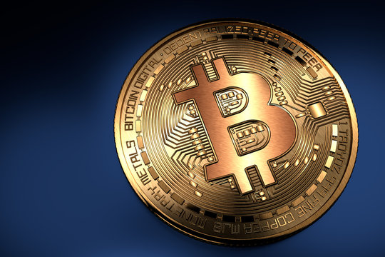 Bitcoin. Pièce de bitcoin dorée gros plan sur fond bleu