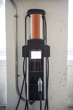 Car charger at electric vehicle charging station