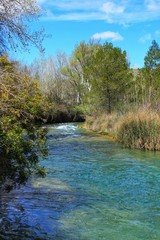 Cabriel River with crystal clear waters and surrounded by green vegetation