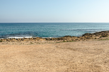 Fototapeta na wymiar Mediterranean sea beach on a sunny summer day