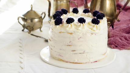 many layers cake with Vanilla Cream and blackberry, Cake Milchmädchen, milky girl , silver coffee pots