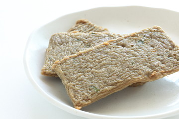 Asian food, oily fish cake on dish