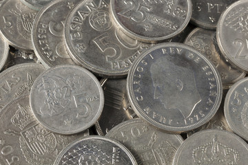 Bunch of peseta coins from Spain, with effigy of King Juan Carlos I. Money out of legal tender. Coins from years 1975 to 1982.