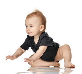 9 month infant child baby  girl toddler crawling in dark grey shirt isolated 