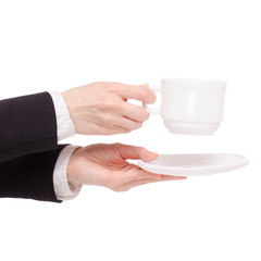 Cup of coffee tea and saucer in female hand business woman